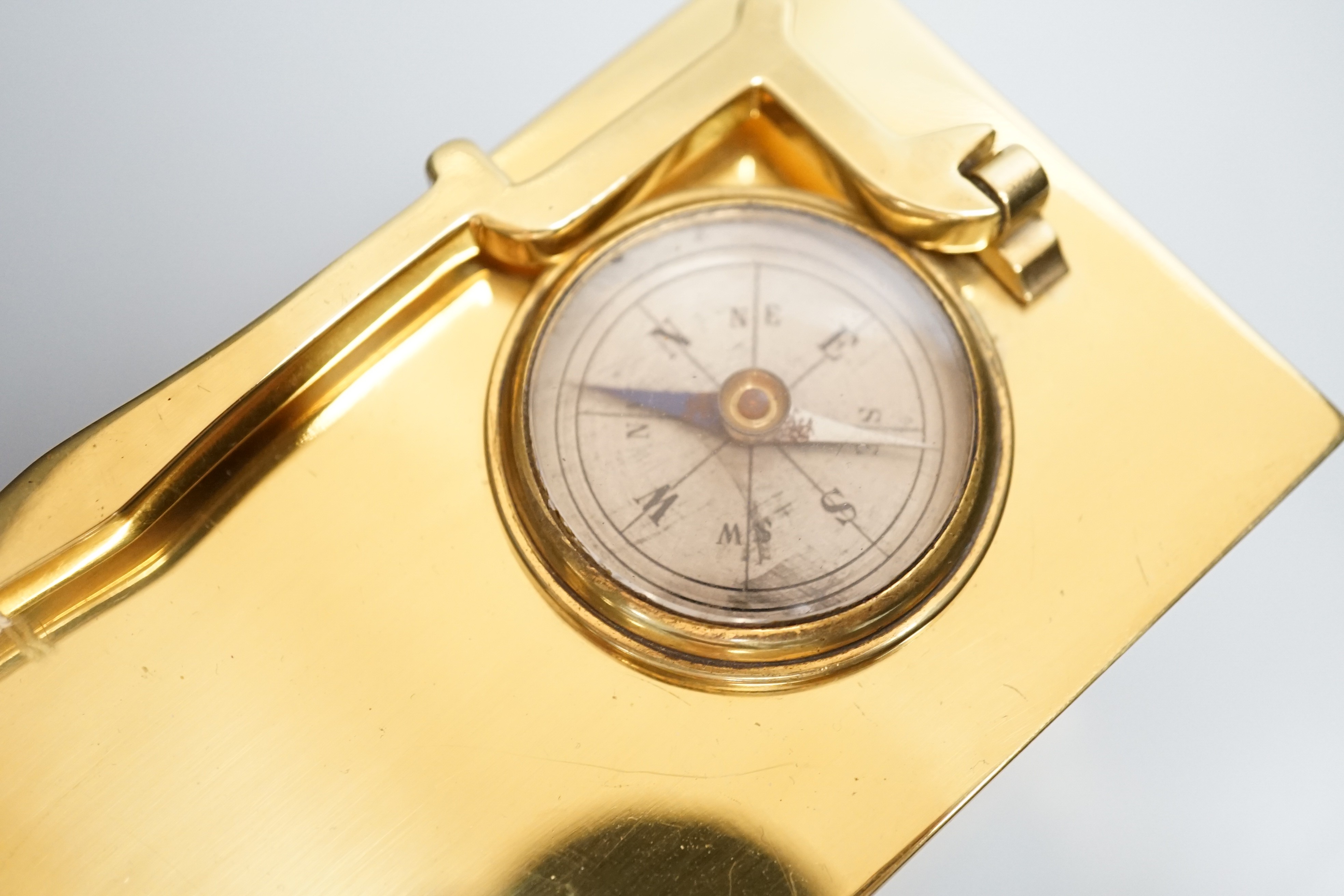 A late 19th century French brass cased eight day timepiece, combined barometer/compass, heighg 11cm